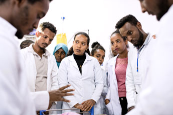 Medical staff gather together.